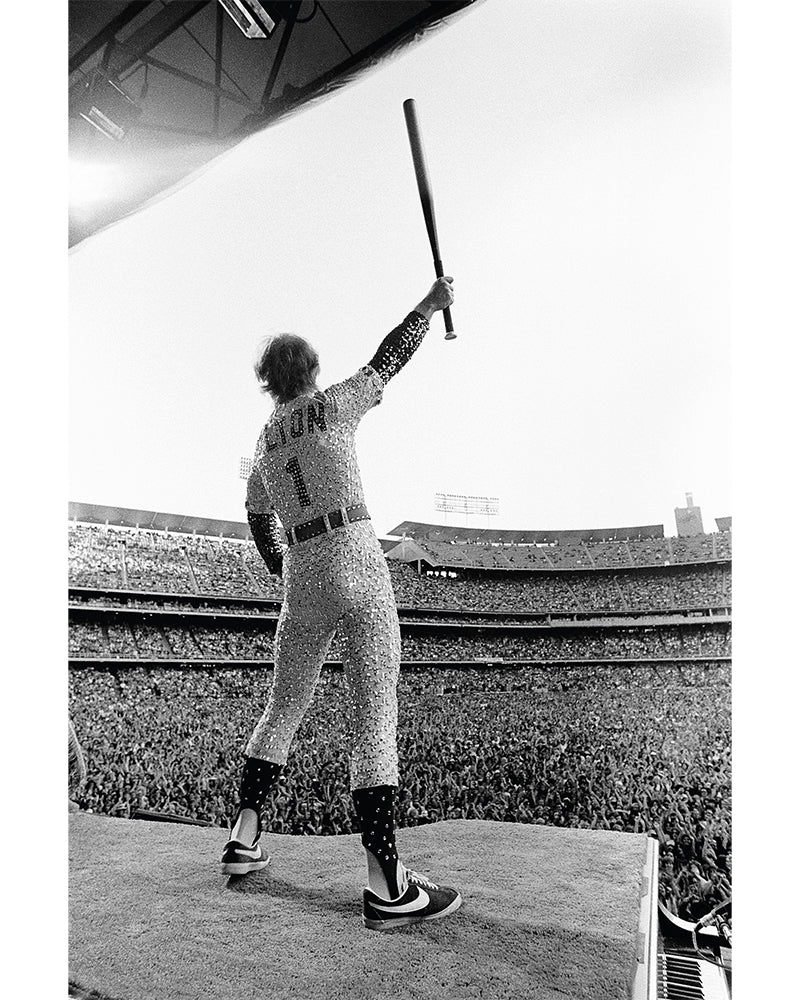 Elton John standing on a piano (colourised), 1975 — Limited Edition Print — Terry O'Neill
